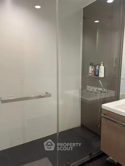 Modern bathroom with glass shower and sleek fixtures