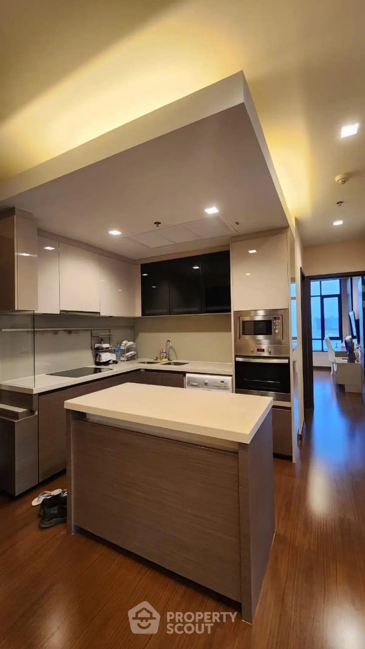 Modern kitchen with sleek cabinetry and built-in appliances in a stylish apartment.