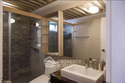Modern bathroom with glass shower and stylish fixtures