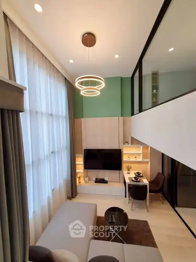 Modern loft-style living room with high ceilings and elegant lighting