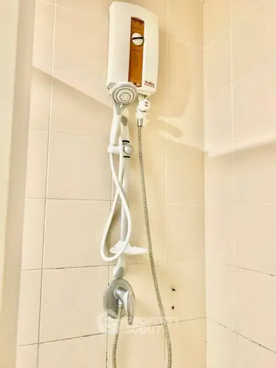 Modern bathroom shower with water heater in tiled enclosure