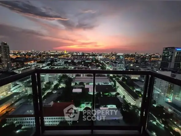 Stunning cityscape view from high-rise balcony at sunset, perfect for urban living.
