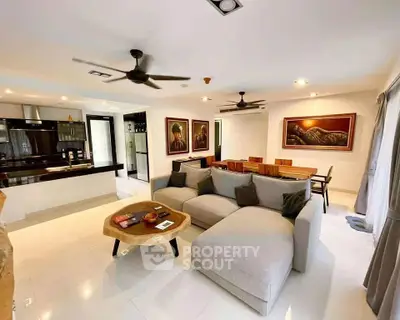 Spacious modern living room with open kitchen and elegant decor