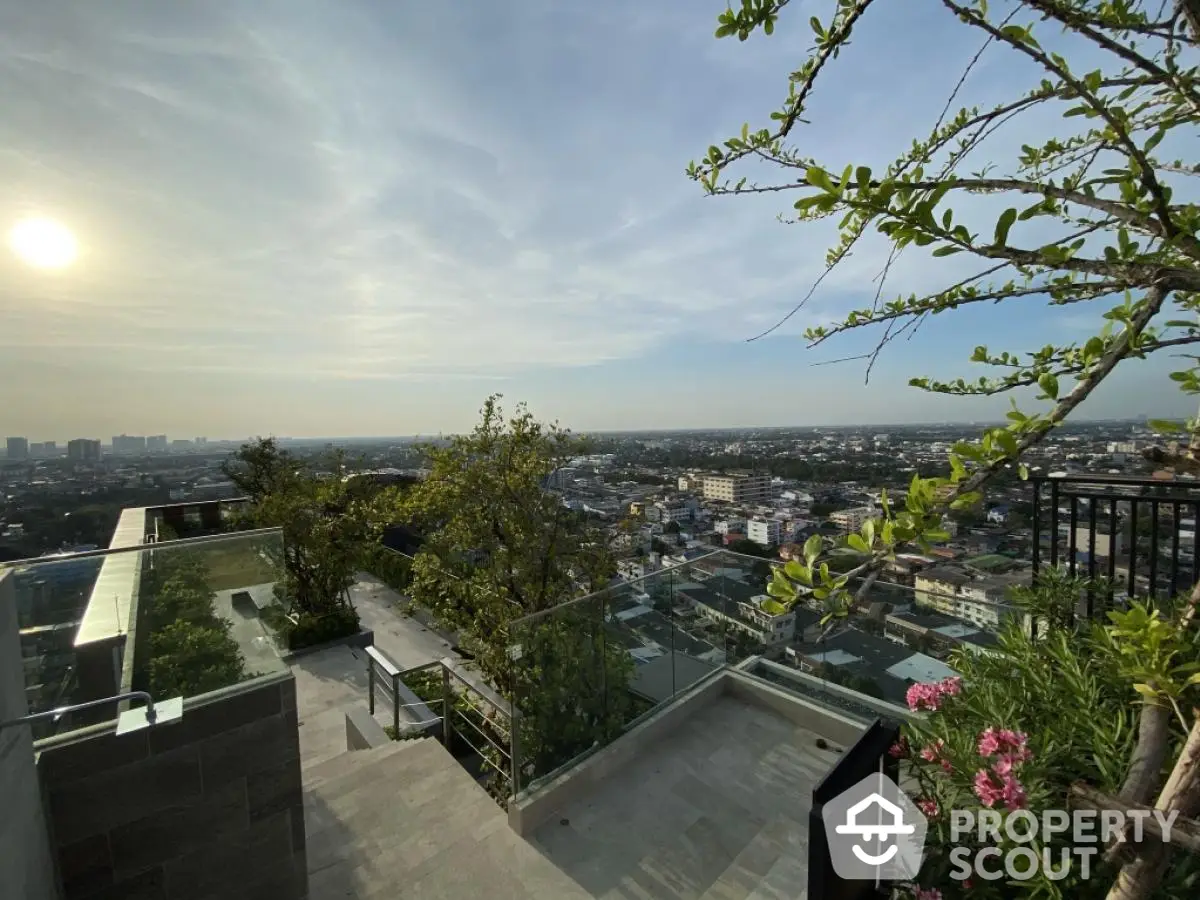 Stunning rooftop view with panoramic cityscape and lush greenery, perfect for urban living.