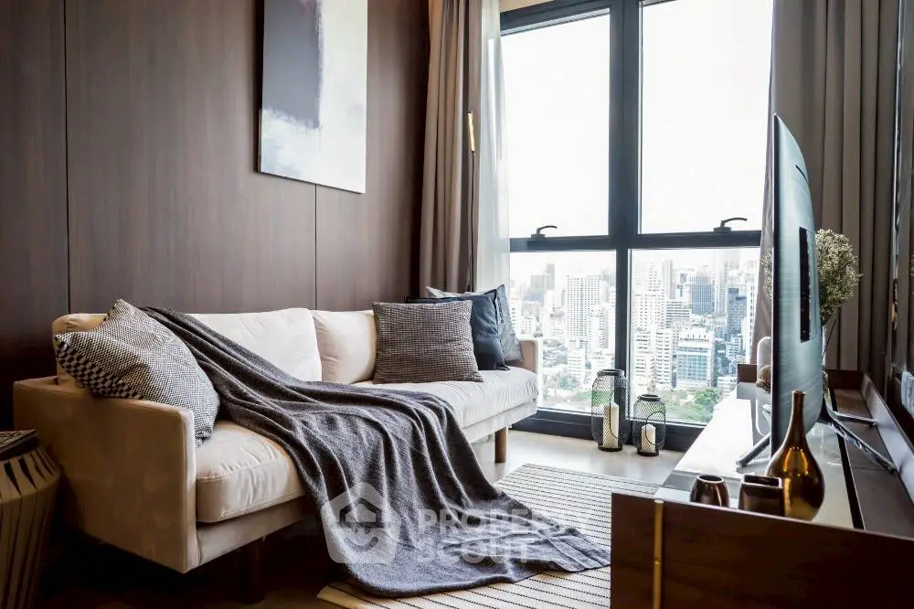 Stylish modern living room with city view, cozy sofa, and elegant decor.