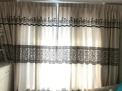 Elegant living room with decorative curtains and soft natural light