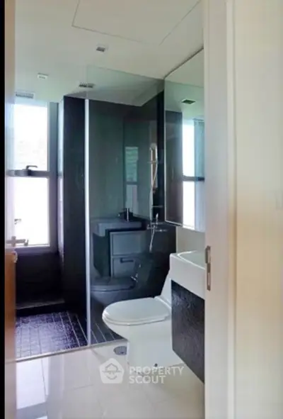 Modern bathroom with sleek design and glass shower enclosure