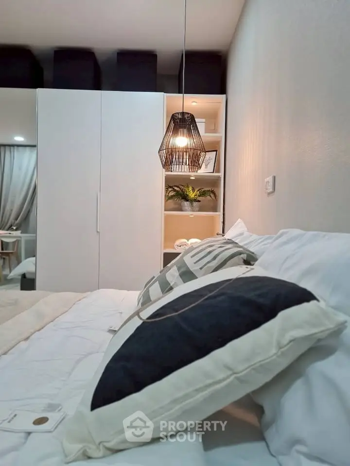 Cozy bedroom with modern lighting and stylish decor