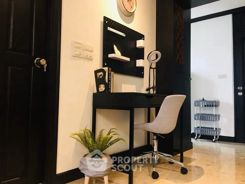 Chic home office corner with modern desk and chair, perfect for productivity.