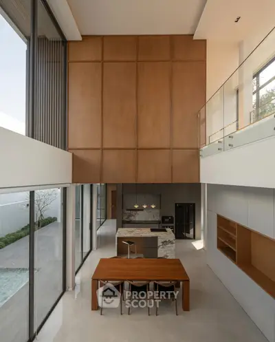 Luxurious modern living room with high ceiling and open kitchen layout