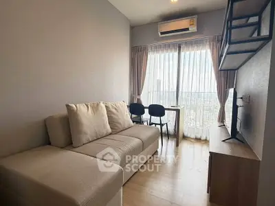 Modern living room with cozy sofa and city view through large window.