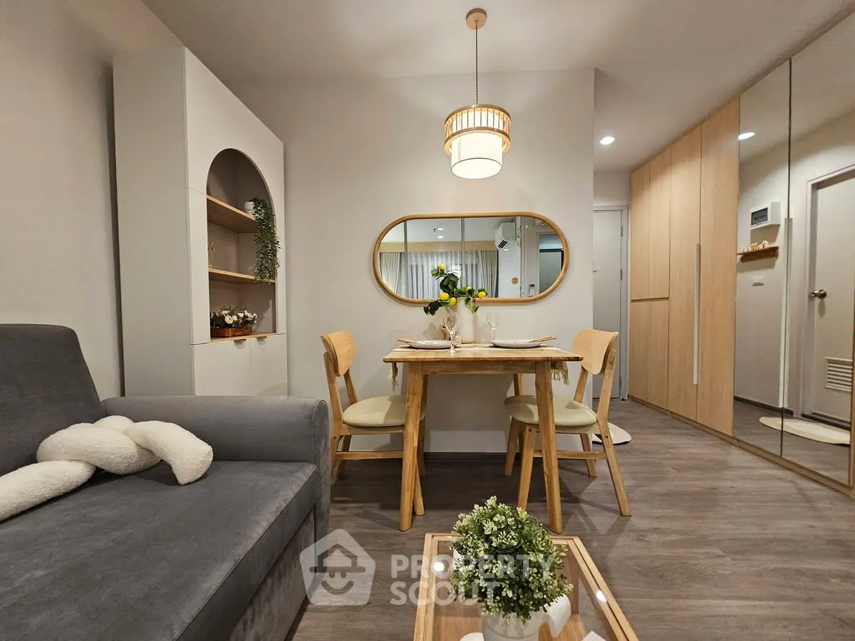 Chic modern living room with dining area, stylish decor, and cozy ambiance.
