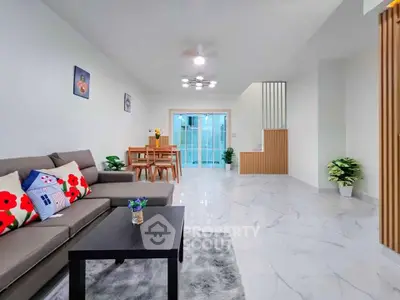 Spacious modern living room with stylish decor and open dining area