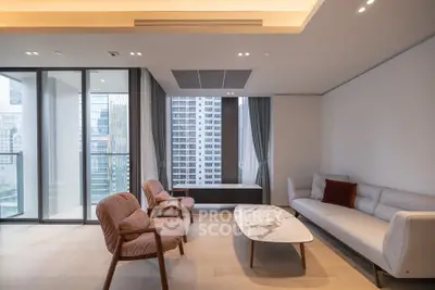 Modern living room with elegant furniture and city view from large windows