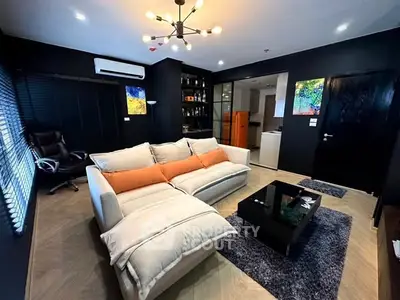 Modern living room with stylish decor and cozy seating area