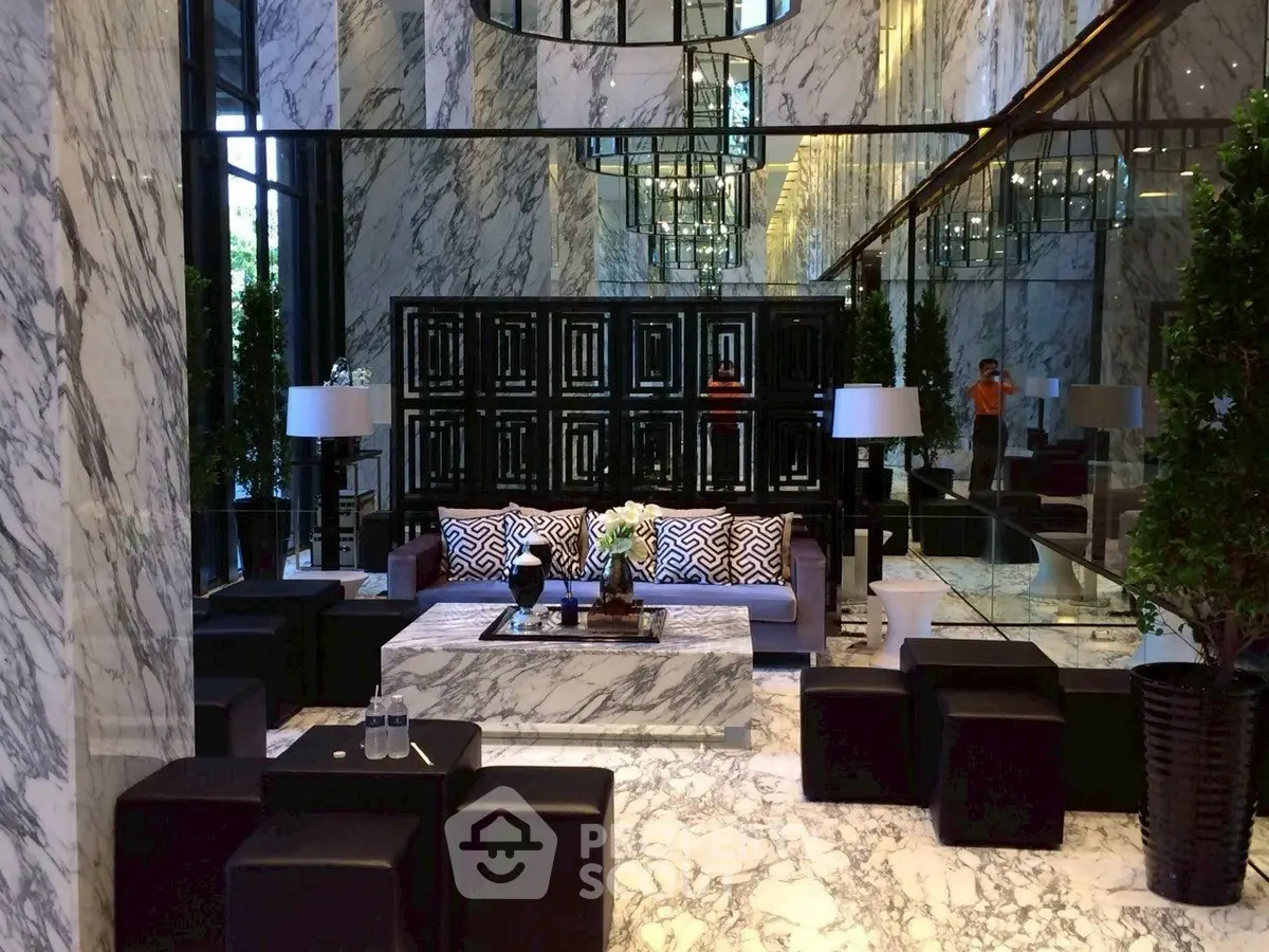 Luxurious marble-finished living room with elegant decor and modern furniture.