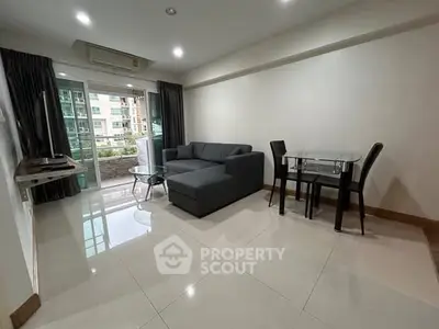 Modern living room with sleek furniture and balcony view in urban apartment