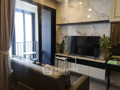 Modern living room with marble accent wall and balcony view
