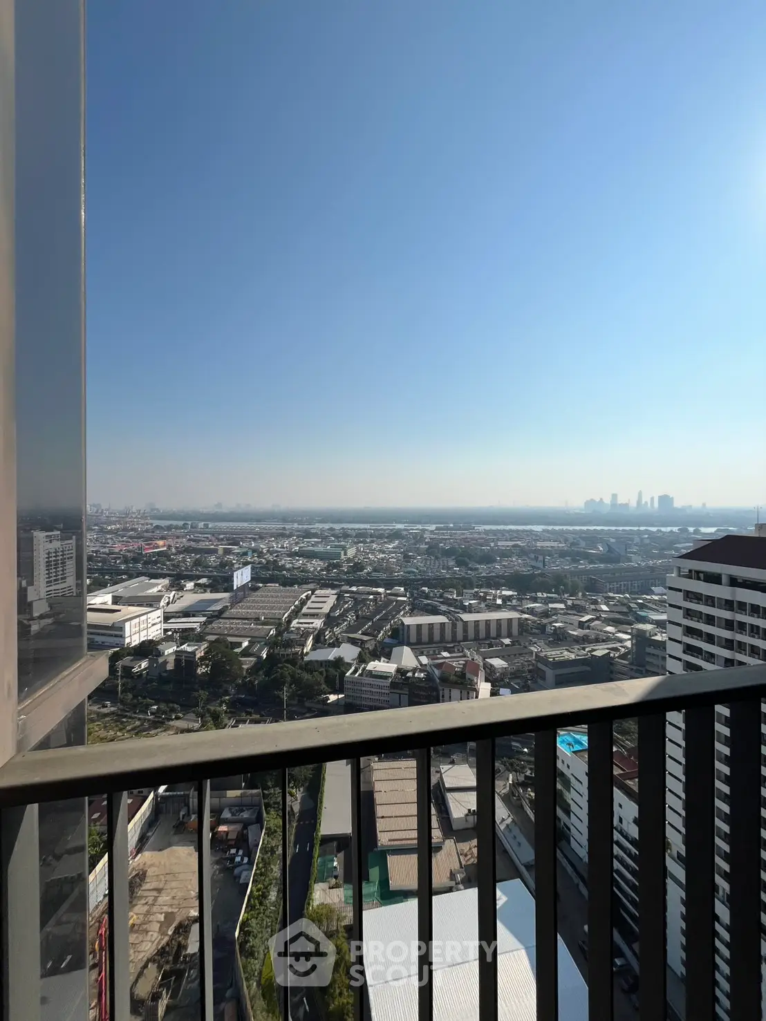 Stunning high-rise balcony view overlooking cityscape and skyline