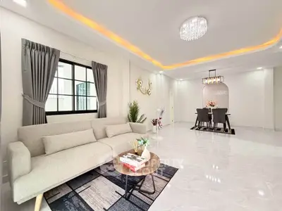 Spacious modern living room with elegant dining area and stylish lighting