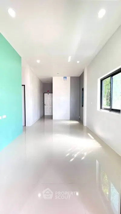 Spacious and bright interior with modern design and large windows.