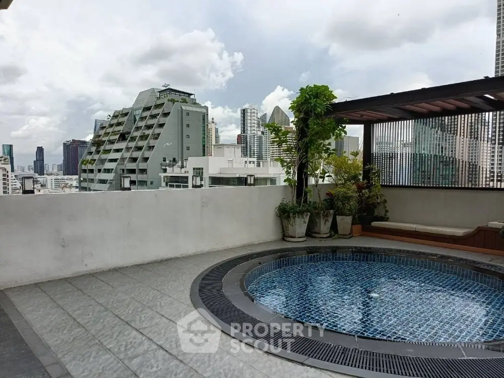Stunning rooftop pool with city skyline view, perfect for urban relaxation.