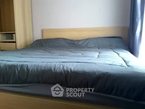 Cozy bedroom with a modern bed and soft lighting, perfect for relaxation.