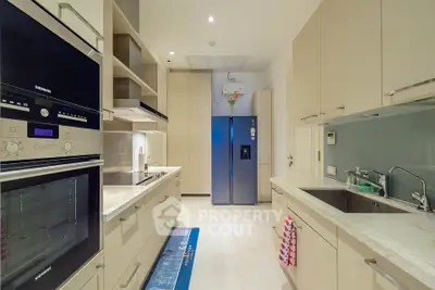 Modern kitchen with sleek appliances and ample storage space