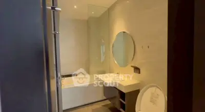 Modern bathroom with bathtub and sleek design in a contemporary apartment.
