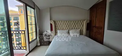 Luxurious bedroom with elegant decor and balcony view in upscale apartment