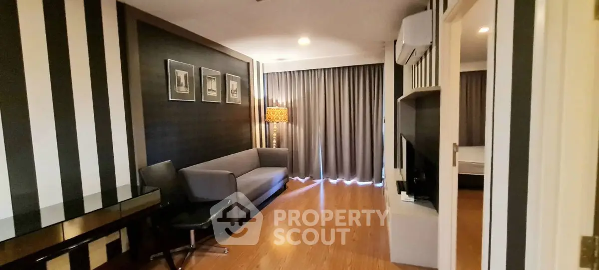 Stylish living room with modern decor and cozy ambiance in a contemporary apartment.