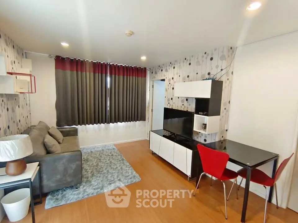 Modern living room with stylish decor, cozy sofa, and sleek furniture in a contemporary apartment.