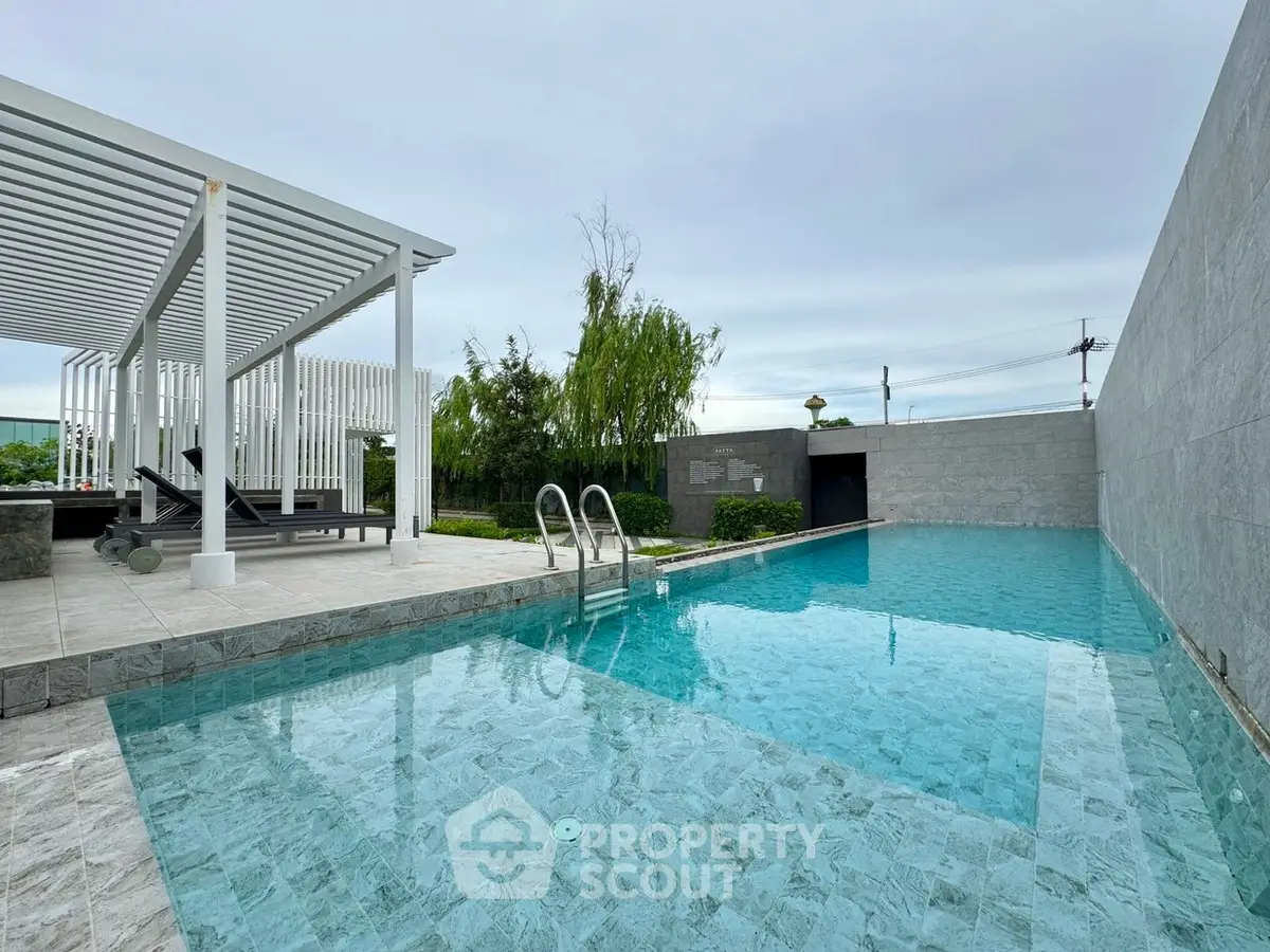Luxurious outdoor pool with modern design and lush greenery