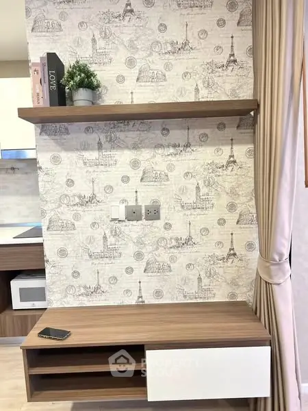 Stylish modern interior with decorative wallpaper and wooden shelving in a cozy living space.