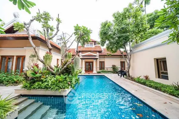 Luxurious villa with stunning pool and lush garden, perfect for serene living.