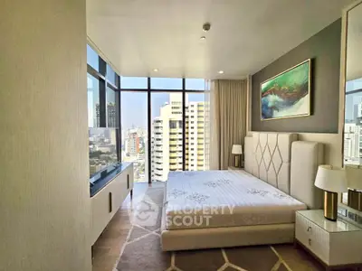 Luxurious bedroom with stunning city view in high-rise apartment