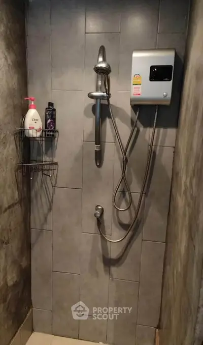 Modern bathroom shower with sleek design and wall-mounted water heater.
