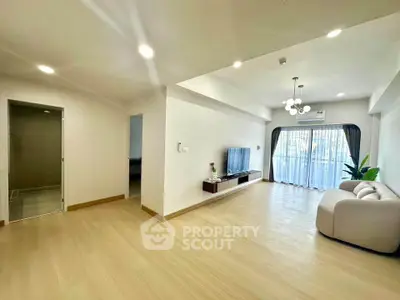 Spacious modern living room with elegant decor and natural light