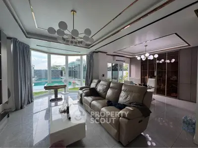 Luxurious living room with pool view and modern lighting