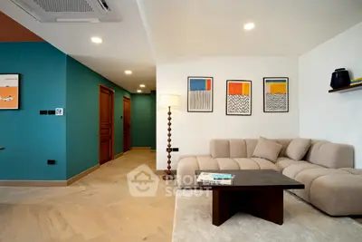 Modern living room with stylish decor and cozy beige sofa