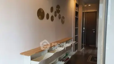 Stylish hallway with modern decor and ample storage space in a contemporary home.