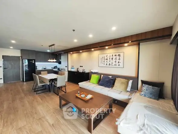 Spacious modern living room with open kitchen and elegant decor