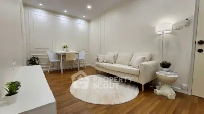 Charming living room with cozy sofa and elegant decor, perfect for relaxation.