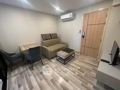 Modern living room with sleek furniture and air conditioning in a cozy apartment.
