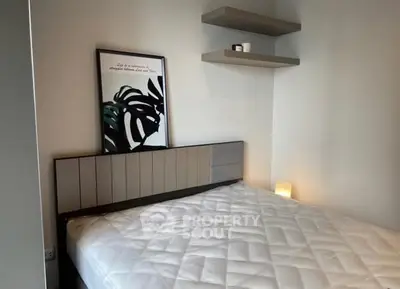 Modern bedroom with stylish decor and cozy ambiance.