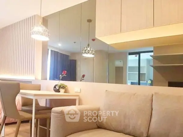 Modern living room with elegant dining area and stylish lighting fixtures