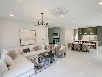 Spacious modern living room with elegant decor and open kitchen layout
