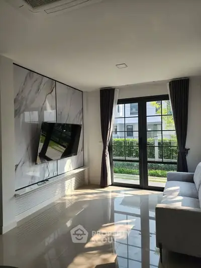 Modern living room with large window and stylish decor