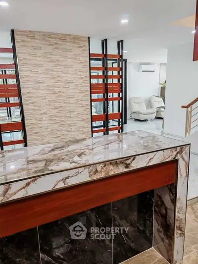Modern interior with marble accents and open layout in a stylish living space.