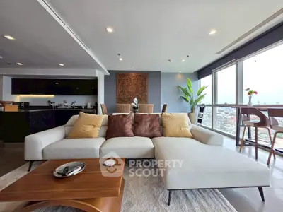 Luxurious open-plan living room with stunning city views and modern furnishings.